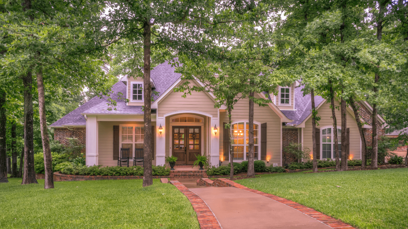 Modern townhouse with garages and flower garden